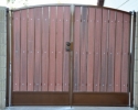 Simple arched RV gate with kickplate using our rust polyurethane paint and the rustic cedar composite privacy slats