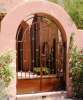 Arched double courtyard entry gate