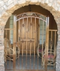 arched decorative gate & side panels securing the entry