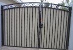 decorative arched gates with plate steel privacy panels