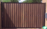 classic-style RV gate with black steel and dark composite